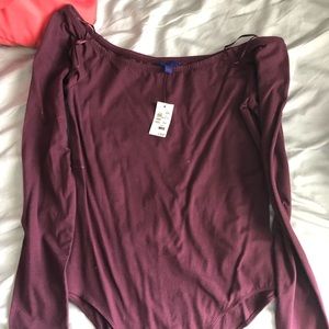 Plum long sleeved body suit.